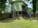 Backyard featuring a multilevel porch, fenced yard and fire pit at 1204 Westridge Sw Rd, Atlanta, GA 30311