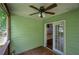 Back porch with a ceiling fan and sliding doors leading inside at 1204 Westridge Sw Rd, Atlanta, GA 30311