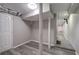 Finished basement with grey walls, wood-look flooring, and access to stairs at 1204 Westridge Sw Rd, Atlanta, GA 30311