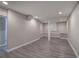 Finished basement with grey walls and wood-look flooring at 1204 Westridge Sw Rd, Atlanta, GA 30311