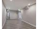 Finished basement offers lots of space with grey walls and wood-look flooring at 1204 Westridge Sw Rd, Atlanta, GA 30311