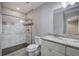 Modern bathroom with walk-in shower and granite vanity at 1204 Westridge Sw Rd, Atlanta, GA 30311