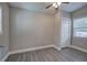 Bright bedroom with grey walls, wood-look flooring, and a large closet at 1204 Westridge Sw Rd, Atlanta, GA 30311