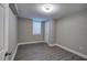 Finished basement bedroom with grey walls and wood-look flooring at 1204 Westridge Sw Rd, Atlanta, GA 30311