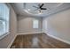 Well-lit bedroom featuring hardwood floors and a ceiling fan at 1204 Westridge Sw Rd, Atlanta, GA 30311