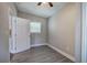 Spacious bedroom with grey walls, wood-look flooring, and an open door at 1204 Westridge Sw Rd, Atlanta, GA 30311