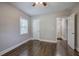 Bedroom with hardwood floors, neutral walls, and access to hallway at 1204 Westridge Sw Rd, Atlanta, GA 30311