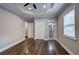 Bright bedroom with hardwood floors, access to bathroom, and walk-in closet at 1204 Westridge Sw Rd, Atlanta, GA 30311