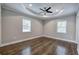 Spacious bedroom with dark hardwood floors and ceiling fan at 1204 Westridge Sw Rd, Atlanta, GA 30311