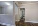 Bright hallway with hardwood floors and neutral walls at 1204 Westridge Sw Rd, Atlanta, GA 30311