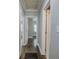 Long hallway with hardwood floors and multiple doors at 1204 Westridge Sw Rd, Atlanta, GA 30311