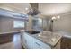 Updated kitchen featuring granite island and stainless steel range hood at 1204 Westridge Sw Rd, Atlanta, GA 30311