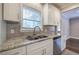 Bright kitchen with granite countertops and double sink at 1204 Westridge Sw Rd, Atlanta, GA 30311