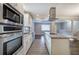 Modern kitchen with stainless steel appliances and granite island at 1204 Westridge Sw Rd, Atlanta, GA 30311