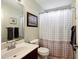 Simple bathroom with shower/tub combo and updated vanity at 1979 Spivey Village Dr, Jonesboro, GA 30236