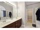 Double vanity bathroom with a large mirror and access to a walk-in closet at 1979 Spivey Village Dr, Jonesboro, GA 30236