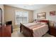 Another well-lit bedroom with a comfortable double bed at 1979 Spivey Village Dr, Jonesboro, GA 30236
