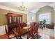 Elegant dining room with hardwood floors and a china cabinet at 1979 Spivey Village Dr, Jonesboro, GA 30236