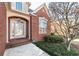 Brick home with a welcoming front porch and landscaped yard at 1979 Spivey Village Dr, Jonesboro, GA 30236
