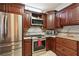 Kitchen features stainless steel appliances and dark wood cabinets at 1979 Spivey Village Dr, Jonesboro, GA 30236