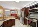Spacious kitchen with stainless steel appliances and ample cabinetry at 1979 Spivey Village Dr, Jonesboro, GA 30236