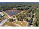 Peaceful lake surrounded by lush greenery at 1979 Spivey Village Dr, Jonesboro, GA 30236