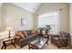Cozy living room featuring a comfortable sofa and arm chair at 1979 Spivey Village Dr, Jonesboro, GA 30236