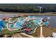 Aerial view of a water park with multiple pools and slides at 1979 Spivey Village Dr, Jonesboro, GA 30236