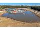 Aerial view of a vibrant water park with slides and a lazy river at 1979 Spivey Village Dr, Jonesboro, GA 30236
