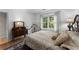 Bedroom with wood floors, lots of natural light and a vintage-style bed at 4250 Edgewater Nw Ct, Kennesaw, GA 30144