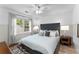 Cozy bedroom featuring a comfy queen bed, soft lighting, and a tranquil ambiance at 4250 Edgewater Nw Ct, Kennesaw, GA 30144