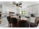 Kitchen with white cabinets, granite countertops, stainless appliances, and island seating at 4250 Edgewater Nw Ct, Kennesaw, GA 30144