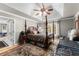 Bedroom with ceiling fan, hardwood floors, and a decorative, coffered ceiling at 4250 Edgewater Nw Ct, Kennesaw, GA 30144