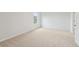 Well-lit bedroom featuring neutral walls and carpet at 1461 Stephens View Dr, Loganville, GA 30052