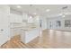 Modern kitchen with white cabinets, granite countertops, and an island at 1461 Stephens View Dr, Loganville, GA 30052