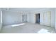 Large bedroom with ample space and neutral paint at 1451 Stephens View Dr, Loganville, GA 30052