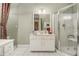 White bathroom with a shower and a vanity at 1045 N Main Nw St, Conyers, GA 30012