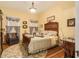 Charming bedroom featuring a period bed and hardwood floors at 1045 N Main Nw St, Conyers, GA 30012