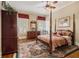 Spacious bedroom with a four-poster bed and hardwood floors at 1045 N Main Nw St, Conyers, GA 30012