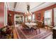 Formal dining room features a large table, chandelier and view into living room at 1045 N Main Nw St, Conyers, GA 30012