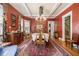 Elegant dining room with a large chandelier, decorative rug, and classic furniture at 1045 N Main Nw St, Conyers, GA 30012