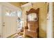 Inviting entryway with antique hall tree and wood floors at 1045 N Main Nw St, Conyers, GA 30012