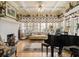 Sunlit living room with a decorative fireplace, piano, and comfortable seating for entertaining at 1045 N Main Nw St, Conyers, GA 30012