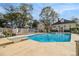 Large swimming pool with diving board and spacious deck at 1045 N Main Nw St, Conyers, GA 30012