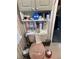 The bathroom is compact with storage options above the toilet, maximizing space for essentials and supplies at 1685 Dogwood Trl, Douglasville, GA 30134