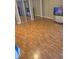 Bedroom featuring a hardwood floor and mirrored closet doors at 1685 Dogwood Trl, Douglasville, GA 30134