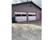 Two-car garage showing a dark trash can and concrete driveway at 1685 Dogwood Trl, Douglasville, GA 30134