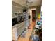Kitchen with laminate floors, appliances, and ample cabinet space for storage at 1685 Dogwood Trl, Douglasville, GA 30134