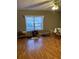 Living room with hardwood floors, a window, and minimalist decor at 1685 Dogwood Trl, Douglasville, GA 30134