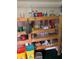 A spacious pantry featuring an open wooden shelving and ample storage for goods at 1685 Dogwood Trl, Douglasville, GA 30134